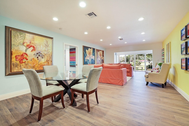 dining room with light wood-type flooring