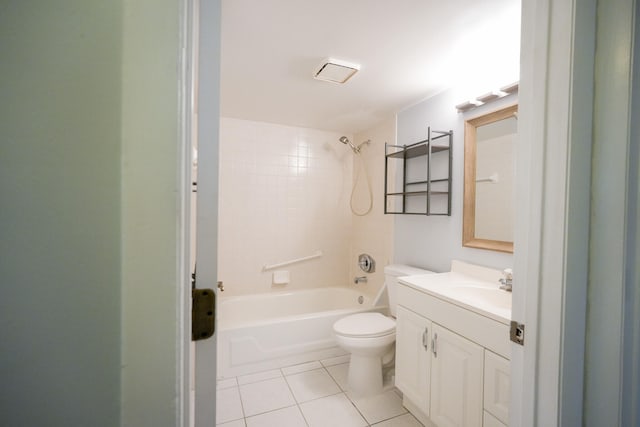 full bathroom featuring tile patterned flooring, vanity, tiled shower / bath combo, and toilet