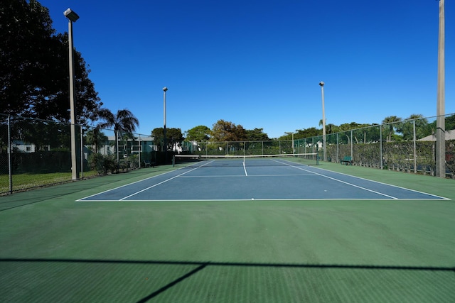 view of tennis court with basketball court