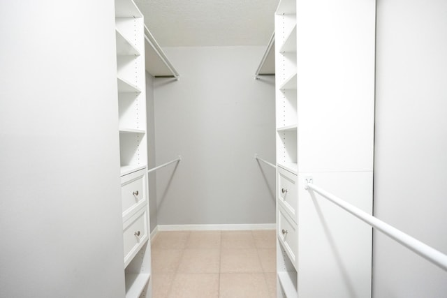 walk in closet featuring light tile patterned floors