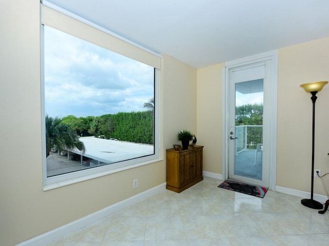 entryway featuring light tile patterned floors