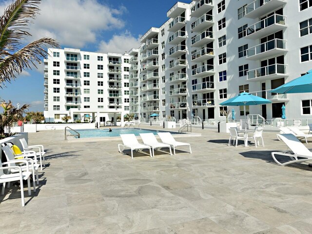 view of pool featuring a patio area