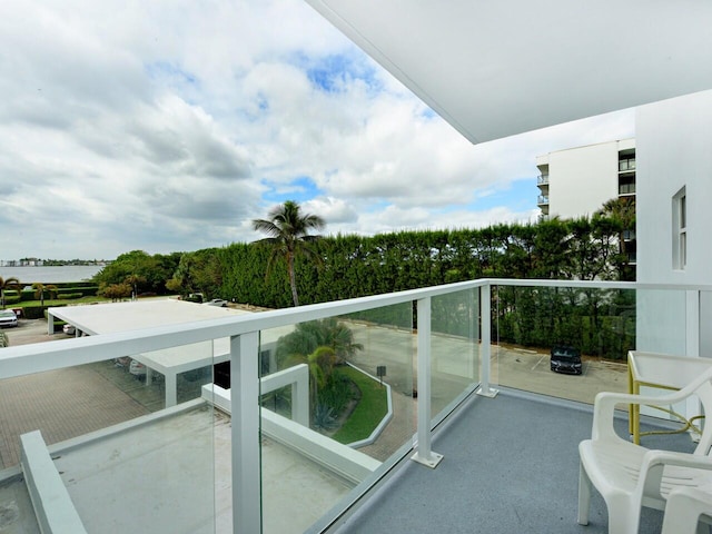 balcony featuring a water view