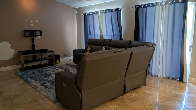 living room with a textured ceiling