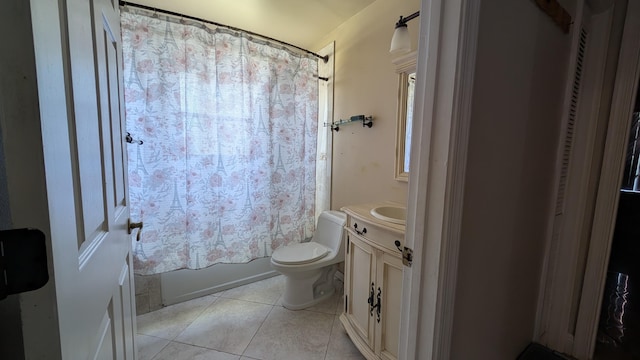 full bathroom with tile patterned floors, shower / tub combo with curtain, vanity, and toilet