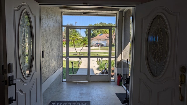 foyer featuring concrete flooring