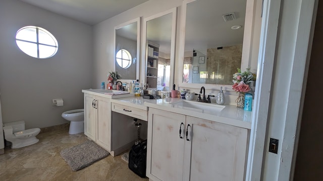 bathroom featuring vanity, toilet, and a shower with shower door