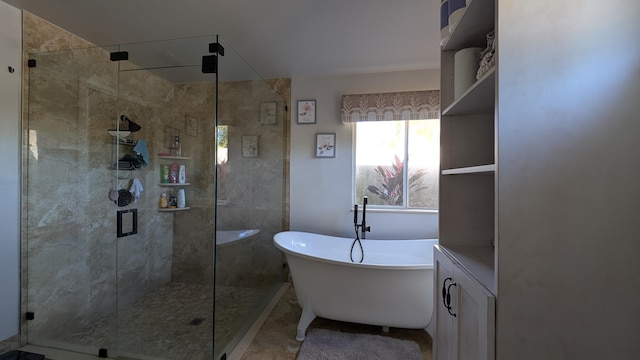 bathroom featuring shower with separate bathtub