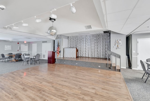 interior space featuring hardwood / wood-style floors, ceiling fan, and track lighting