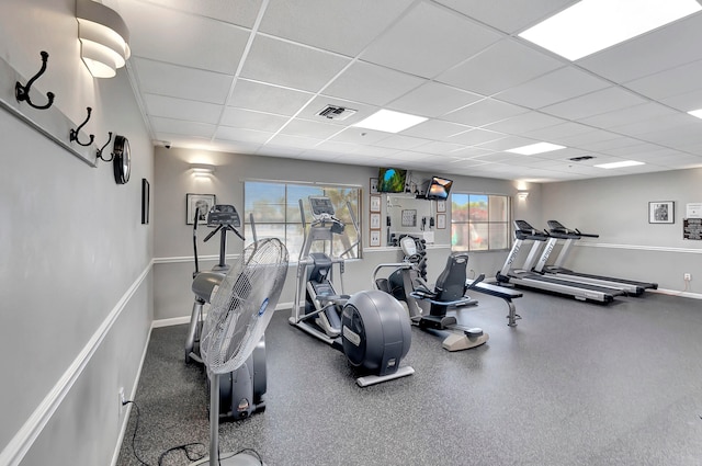 gym featuring a paneled ceiling