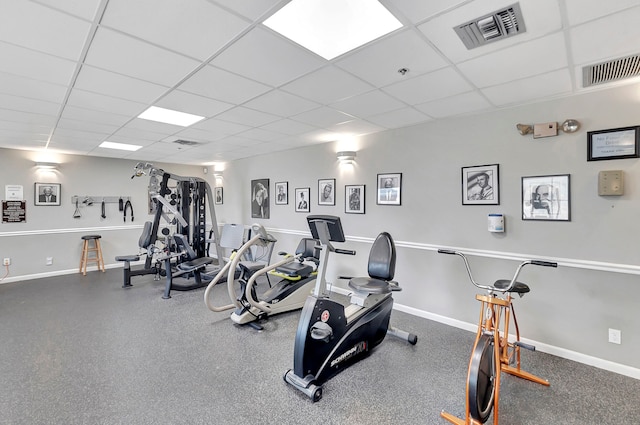 gym featuring a paneled ceiling