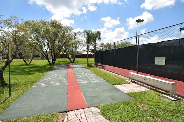 view of property's community featuring a lawn