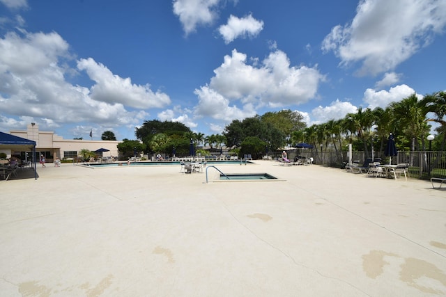 view of home's community featuring a patio area and a swimming pool