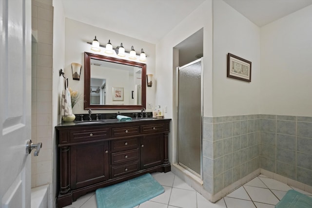 bathroom featuring vanity, an enclosed shower, and tile patterned flooring