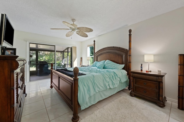 bedroom with ceiling fan, access to exterior, light tile patterned floors, and a textured ceiling