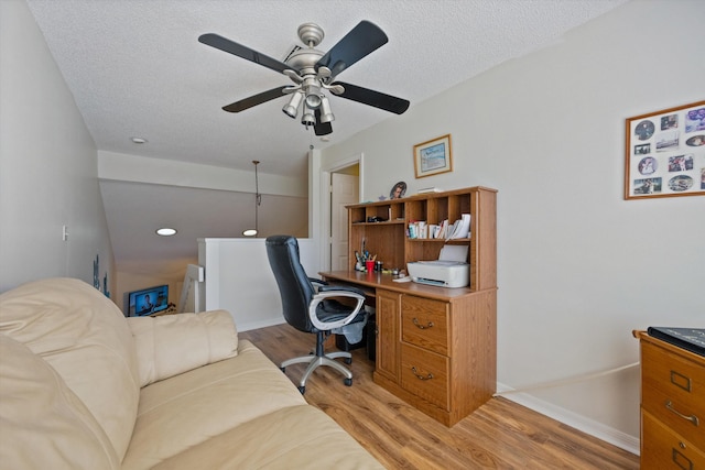 office with ceiling fan, a textured ceiling, and light hardwood / wood-style flooring