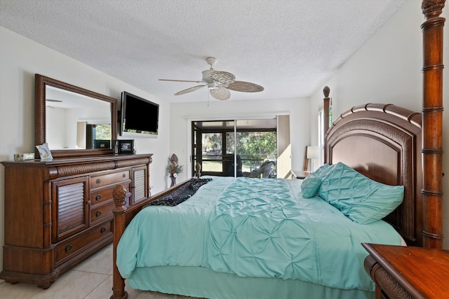 bedroom featuring access to exterior, light tile patterned floors, a textured ceiling, and ceiling fan