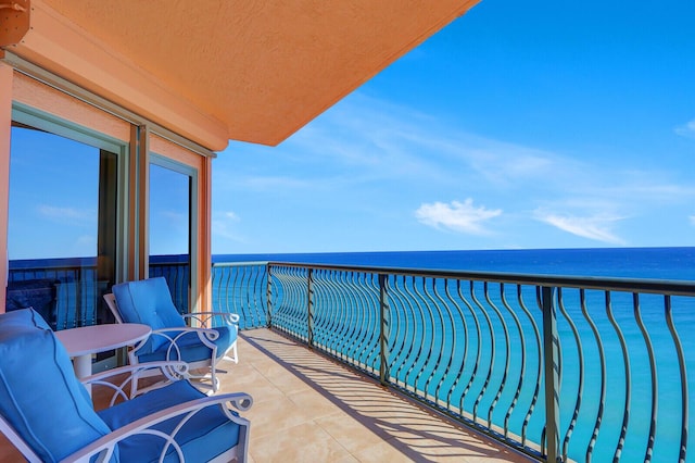 balcony featuring a water view