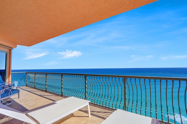 balcony featuring a water view