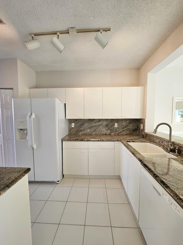 kitchen featuring white cabinets, white appliances, rail lighting, and a textured ceiling