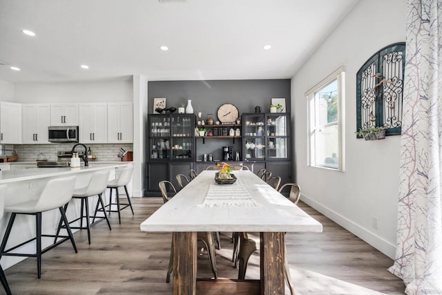 dining space featuring light wood-type flooring