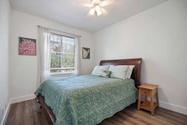 bedroom featuring ceiling fan and dark hardwood / wood-style floors