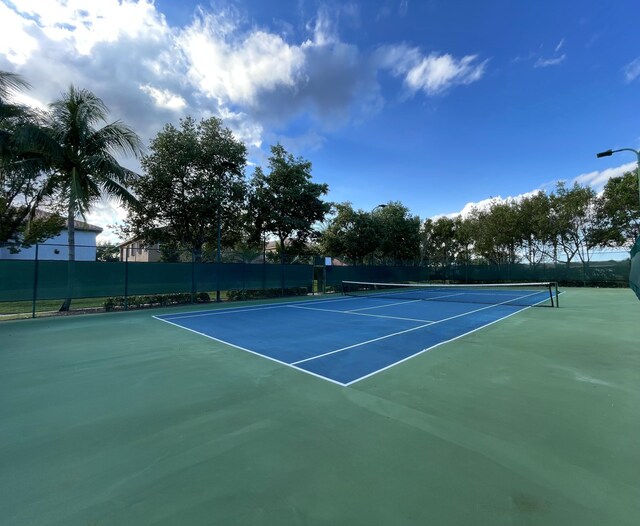 view of basketball court with tennis court