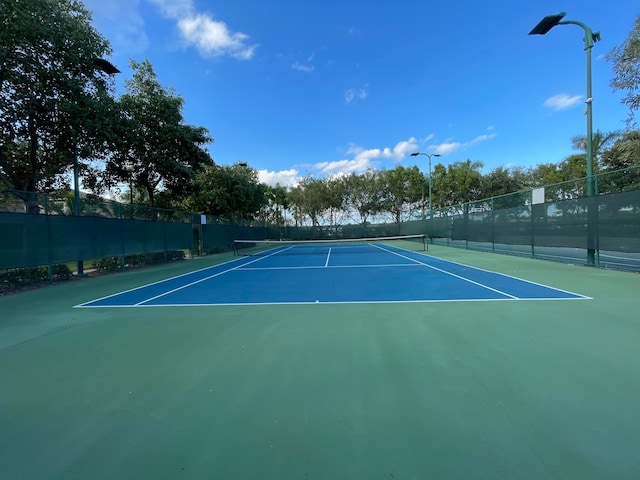 view of tennis court with basketball court