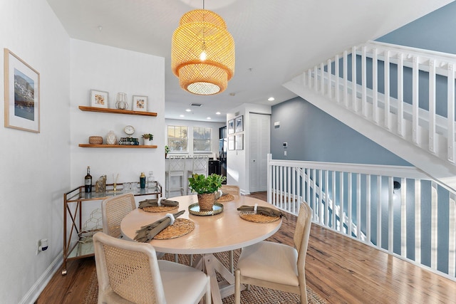 dining area featuring wood-type flooring