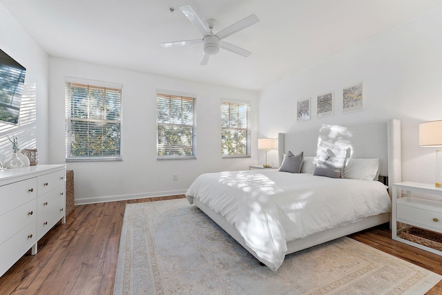 bedroom featuring hardwood / wood-style flooring and ceiling fan