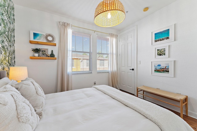 bedroom with hardwood / wood-style floors