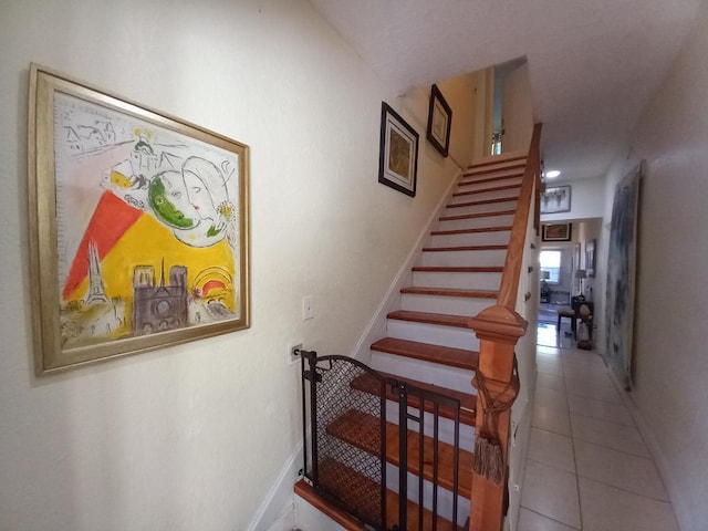 stairway featuring tile patterned floors