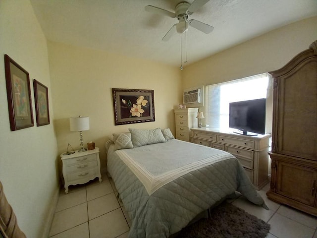 tiled bedroom featuring ceiling fan and an AC wall unit