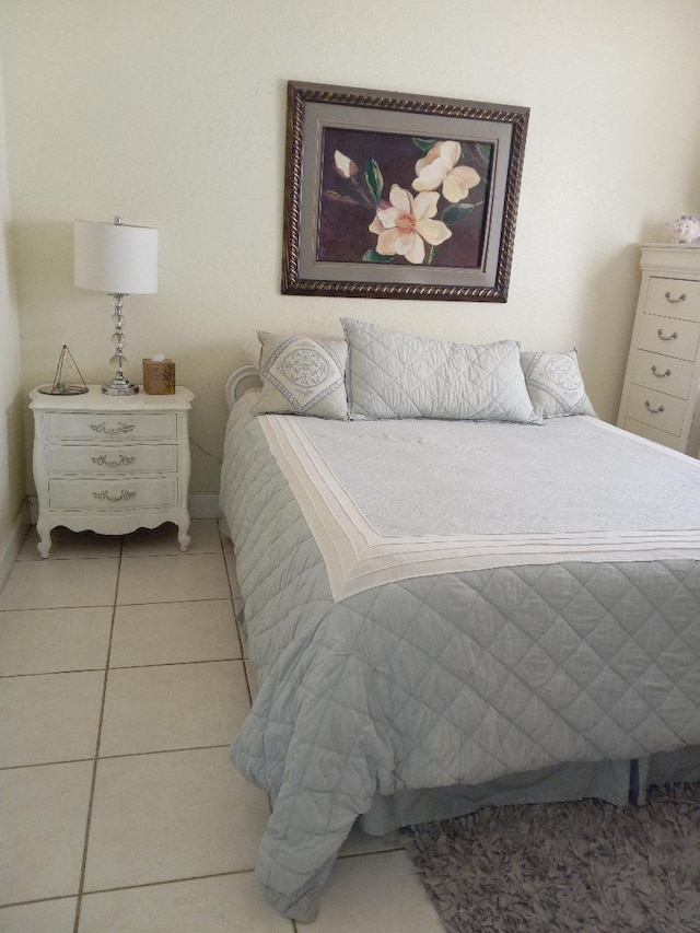 bedroom featuring light tile patterned flooring