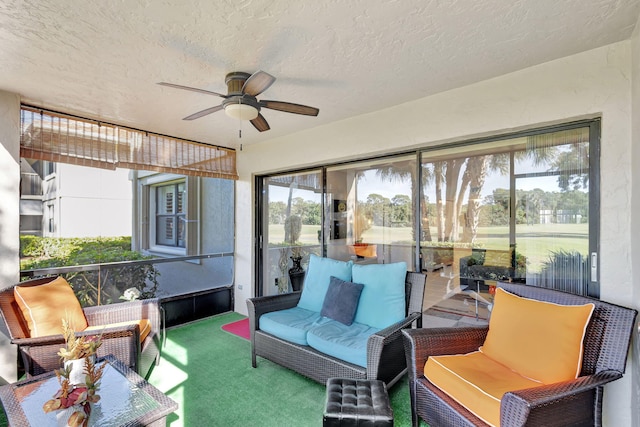 sunroom featuring ceiling fan