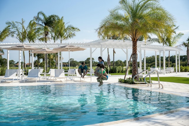 view of pool featuring a pergola and a patio