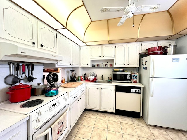 kitchen with white cabinetry, sink, ceiling fan, white appliances, and light tile patterned floors