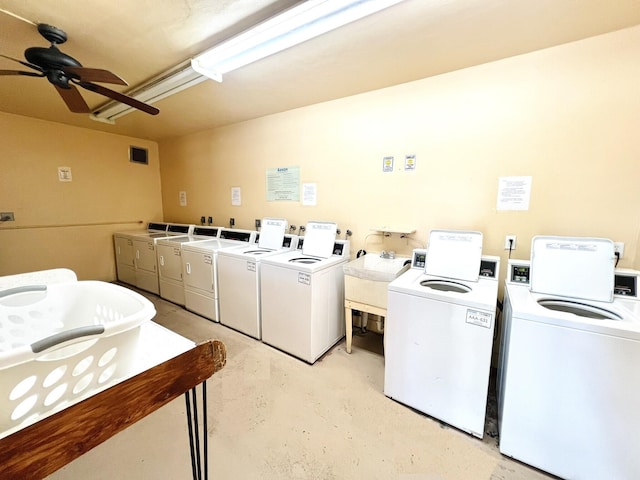 clothes washing area featuring ceiling fan, sink, and independent washer and dryer