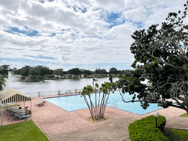 view of pool with a water view