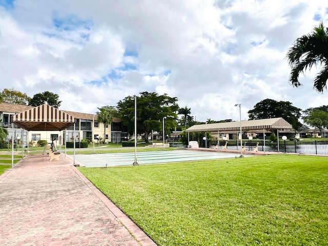 view of community featuring a yard