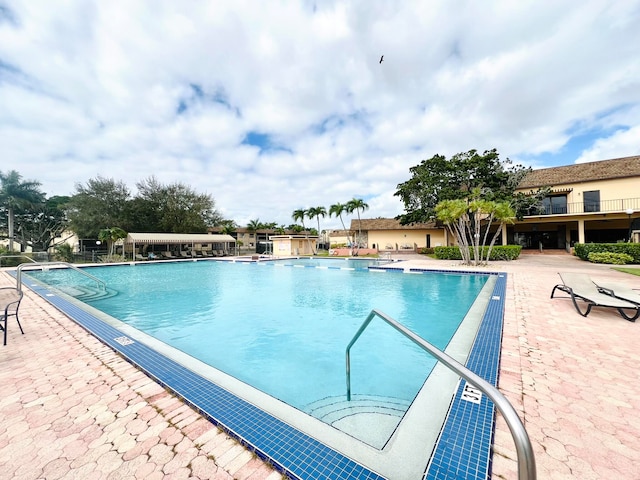 view of swimming pool with a patio area