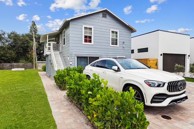 view of side of home with a yard