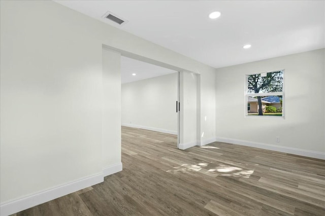 unfurnished room featuring hardwood / wood-style floors