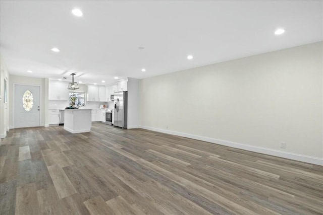 unfurnished living room with hardwood / wood-style floors