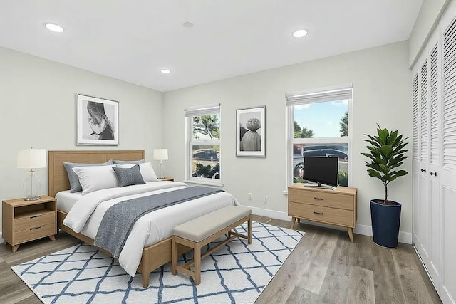 bedroom featuring hardwood / wood-style floors and a closet