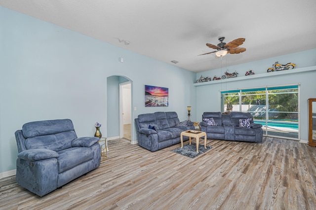 living room with ceiling fan and light hardwood / wood-style floors