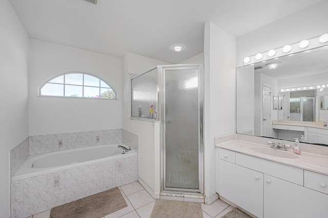 bathroom featuring tile patterned flooring, vanity, and independent shower and bath