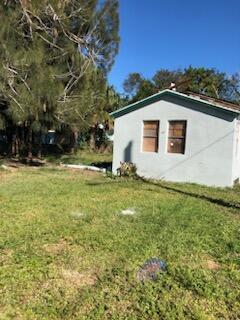 view of home's exterior with a yard