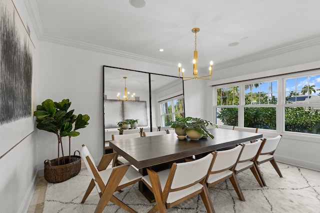 dining room with crown molding and a notable chandelier