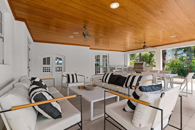 view of patio / terrace with ceiling fan, french doors, an outdoor living space, grilling area, and area for grilling